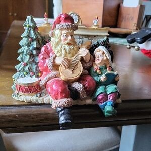 Santa Claus and Child Holiday Figurine